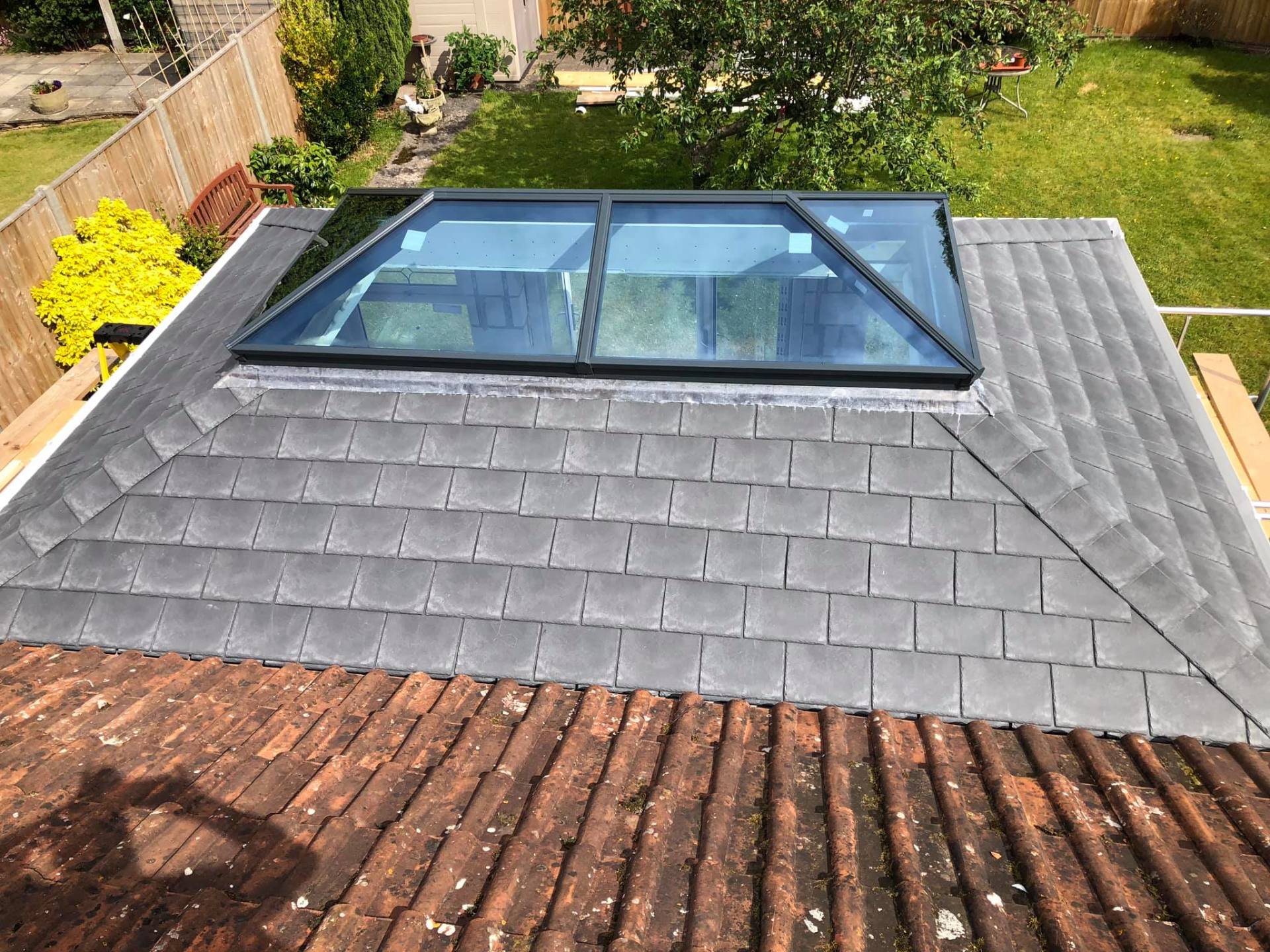 A roof with a skylight on top of it.