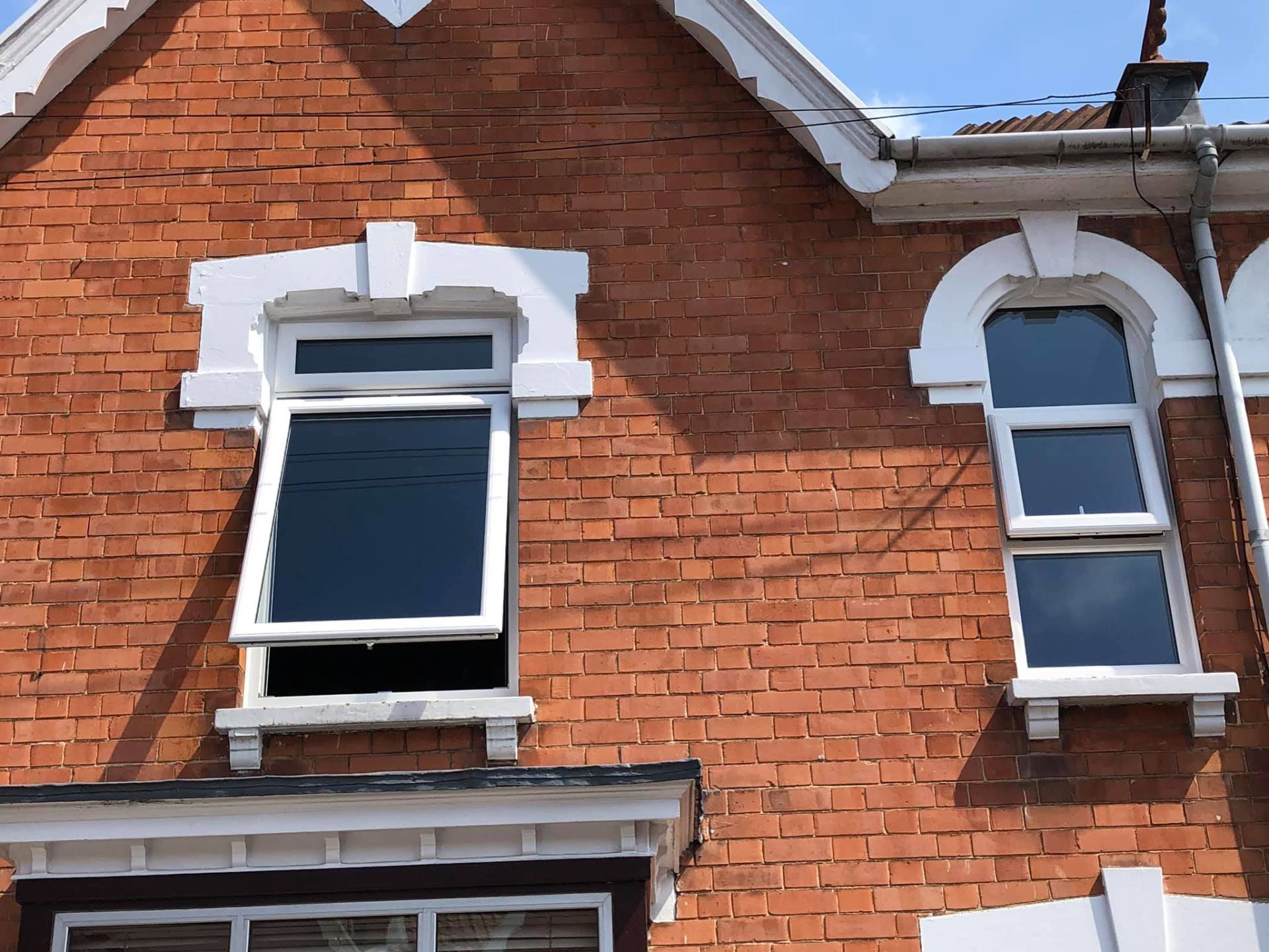 A brick building with a few windows on it