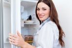Happy customer in front of refrigerator