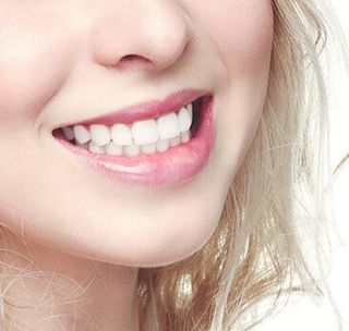 Smiling woman-cosmetic dentistry in bridgeville, pa