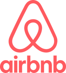 A red airbnb logo on a white background