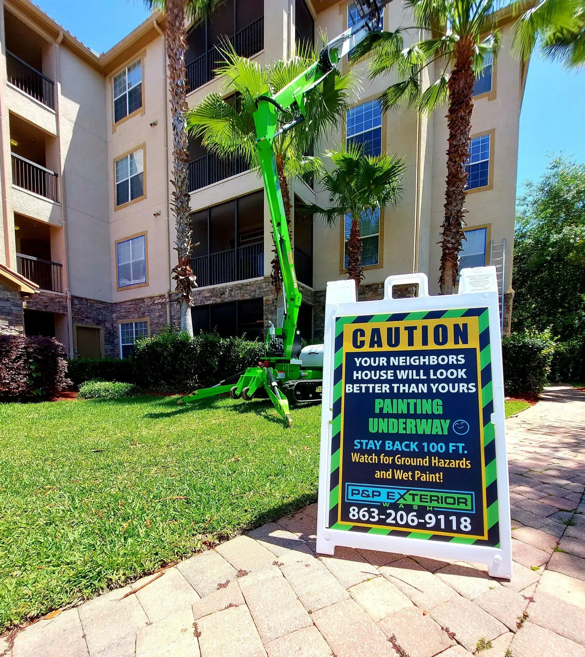 A sign that says caution is in front of a building