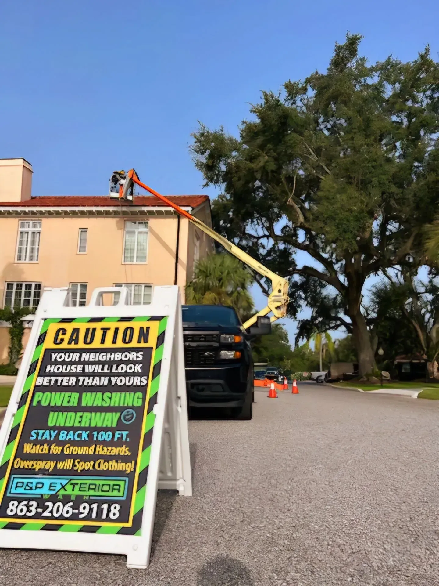 A caution sign is sitting in front of a building.