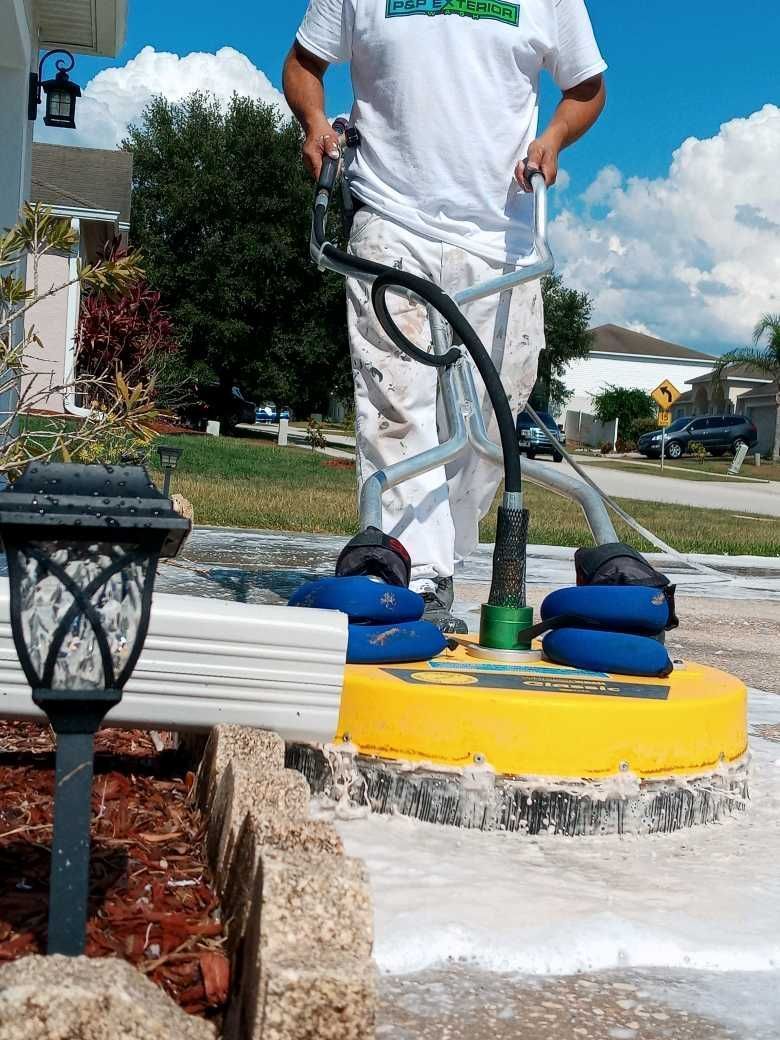 A man in a white shirt is standing next to a yellow object