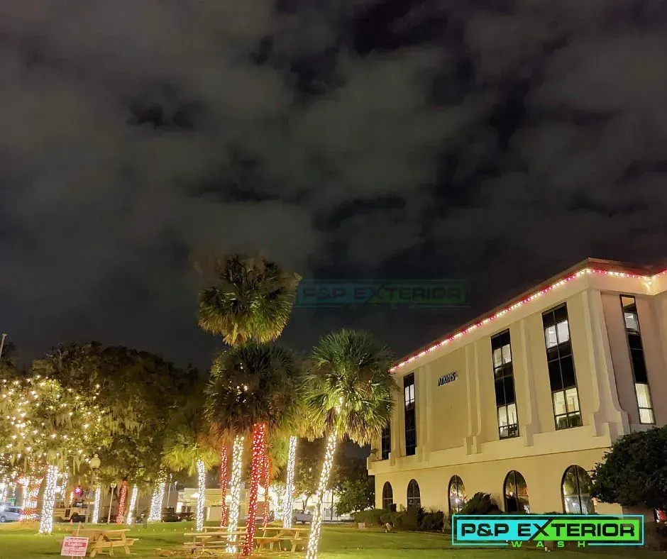 A large building with christmas lights on the side of it