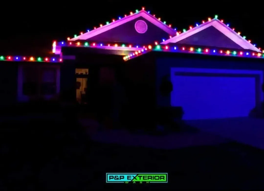 A picture of a house with christmas lights on it