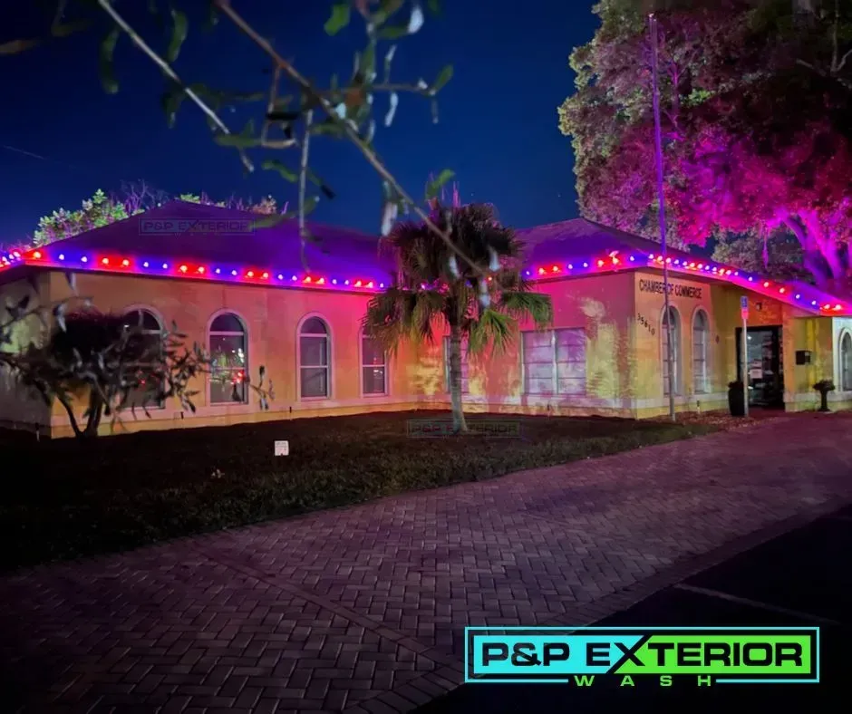 A house with red and purple lights on the roof