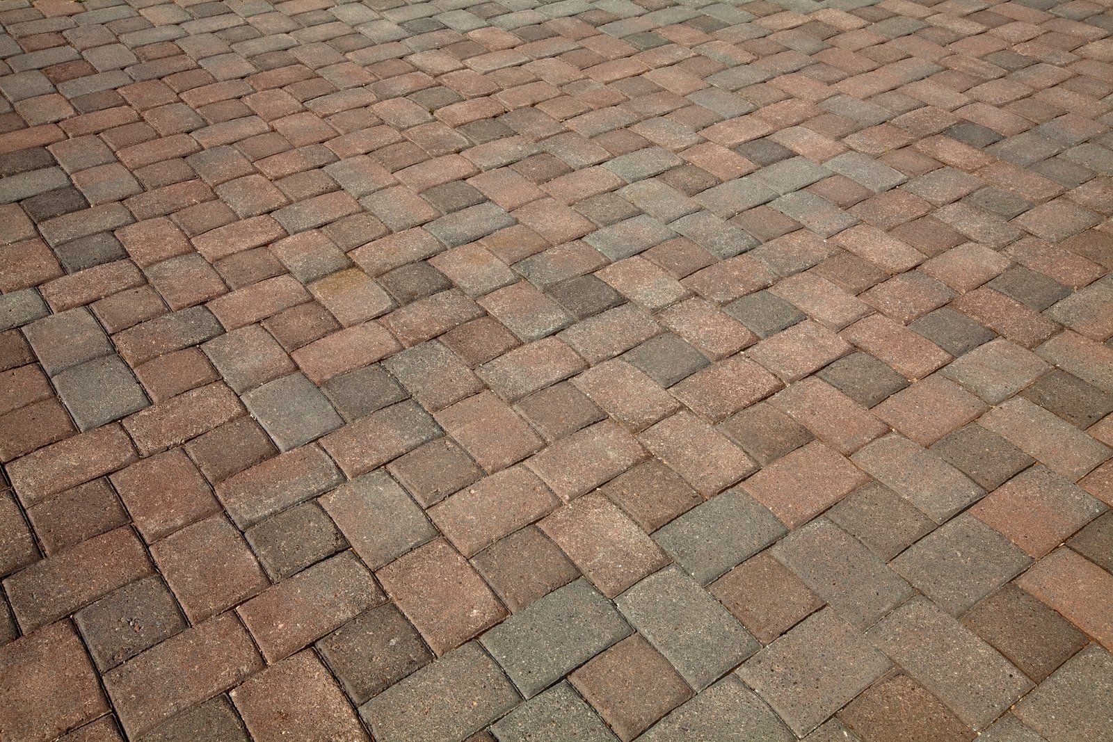 Herringbone brick pattern in shades of red and gray.