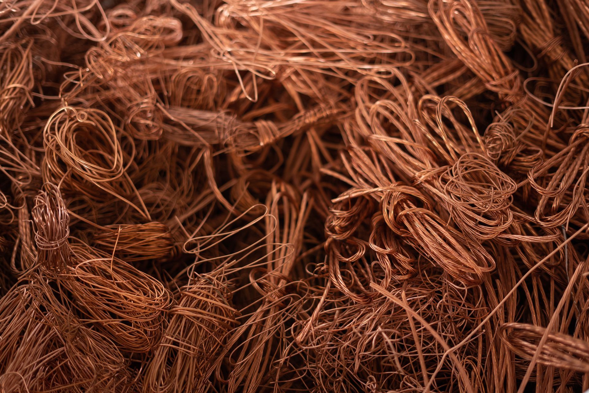 Copper wire scrap. Bundled and loose strands, brown color.