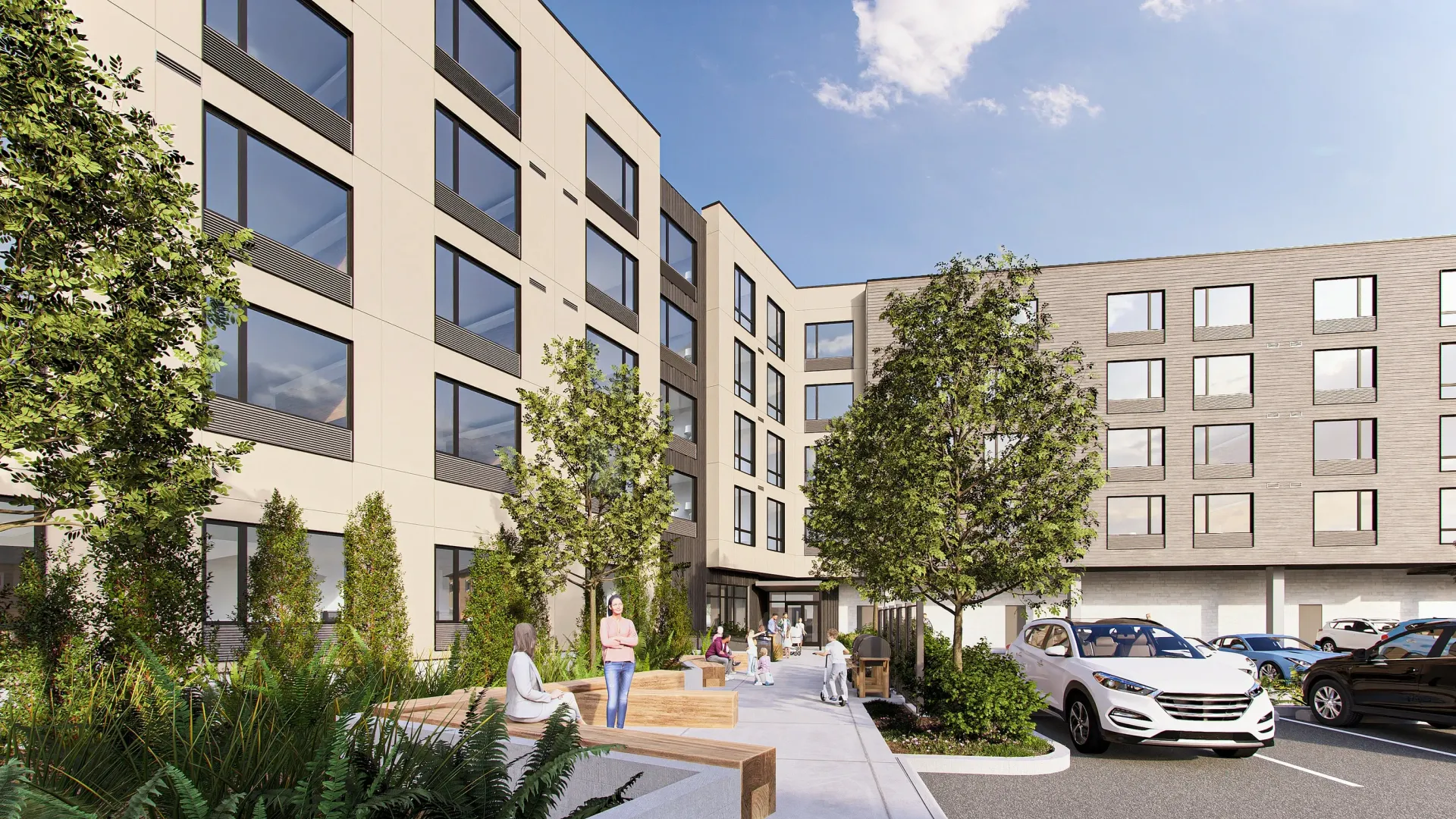 Modern apartment building exterior with green courtyard and parking.