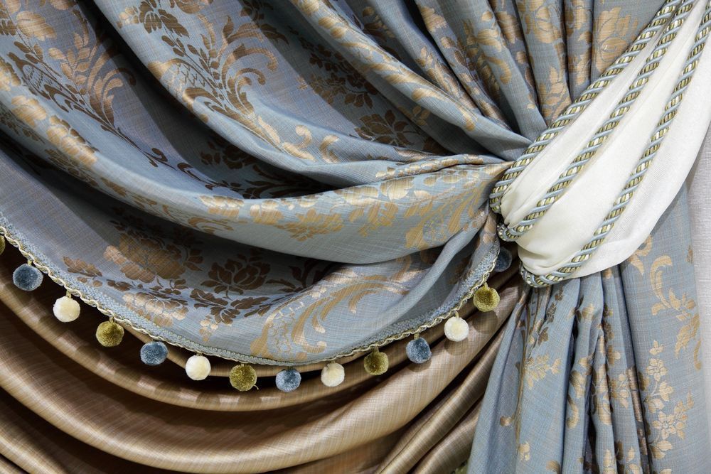 A Close Up of a Curtain With a Tie and Pom Poms β Catrina's Custom Curtains & Blinds in Toukley, NSW