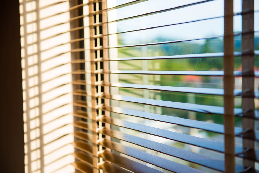 A Close Up of a Window With Blinds on It — Catrina's Custom Curtains & Blinds in Toukley, NSW