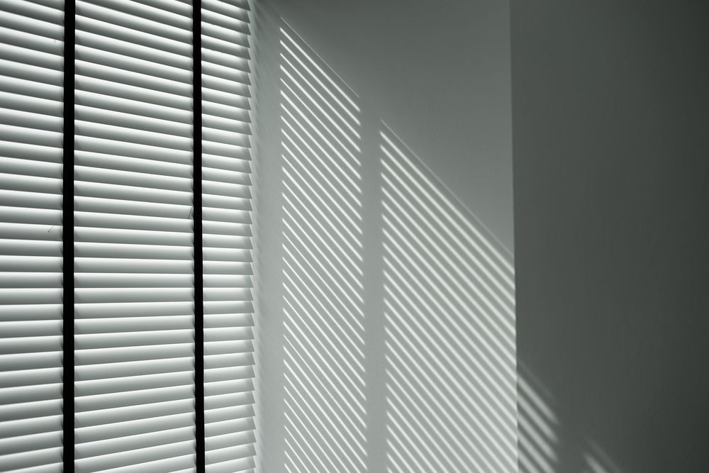 the Sun is Shining Through the Blinds on the Wall — Catrina's Custom Curtains & Blinds in Toukley, NSW