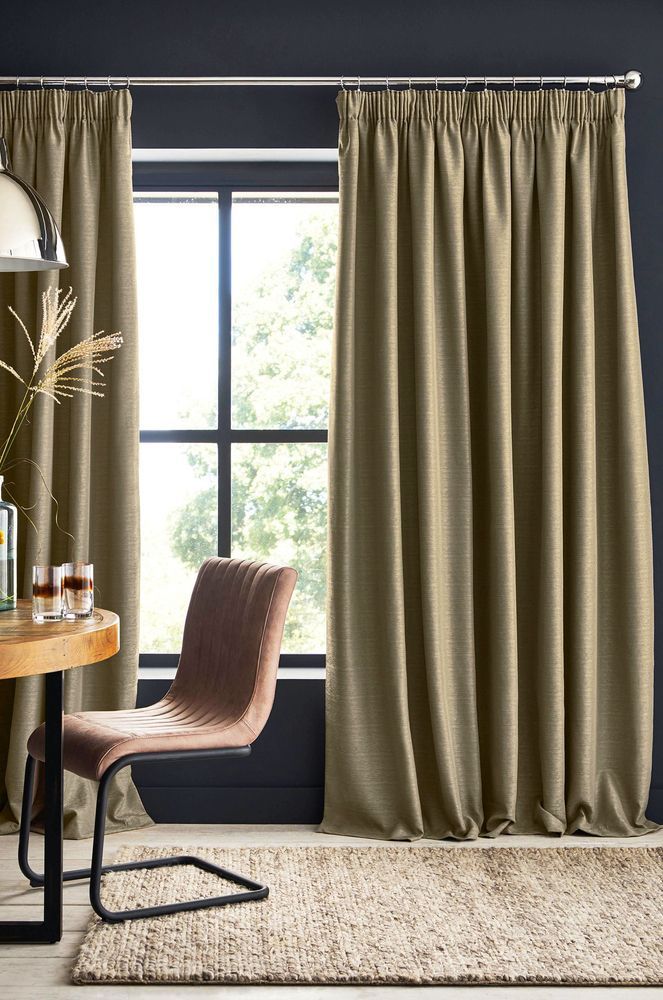 A Living Room With a Table, Chair, Rug and Curtains — Catrina's Custom Curtains & Blinds in Tuggerah, NSW