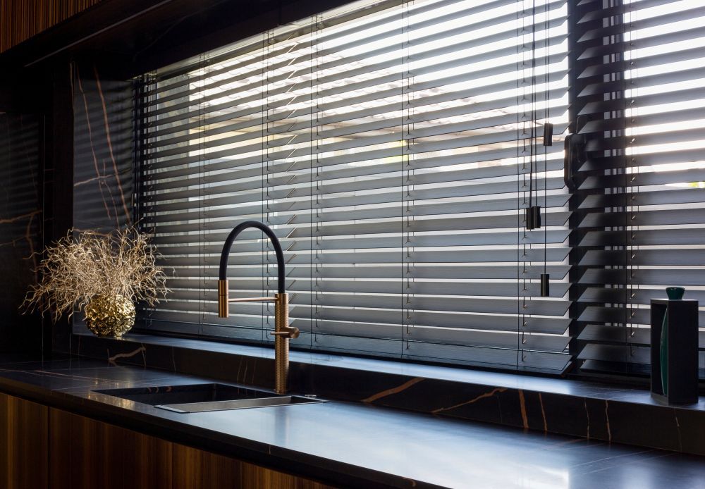 A Kitchen With a Sink and a Window With Blinds — Catrina's Custom Curtains & Blinds in Budgewoi, NSW