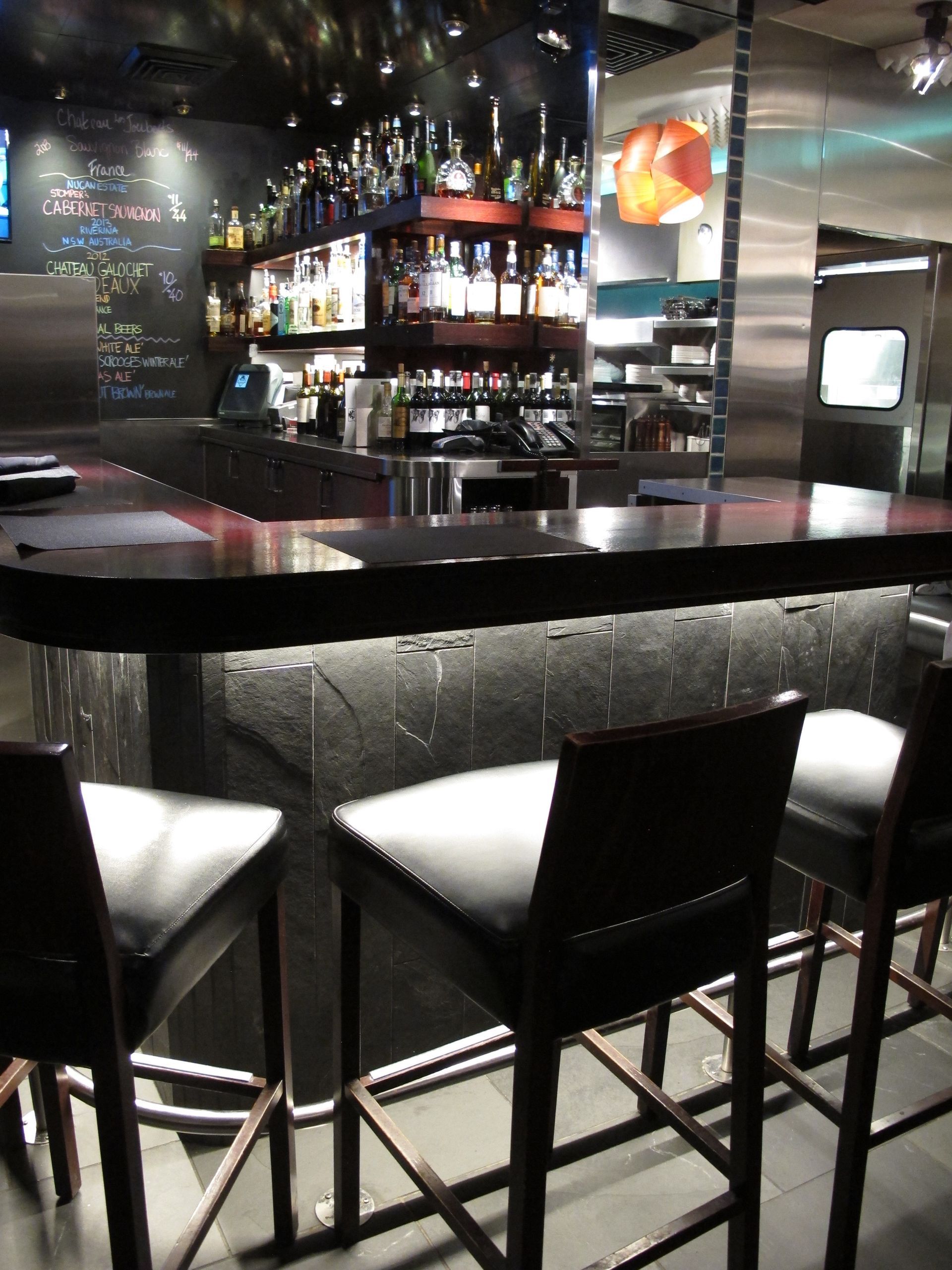 A bar with a lot of bottles on it