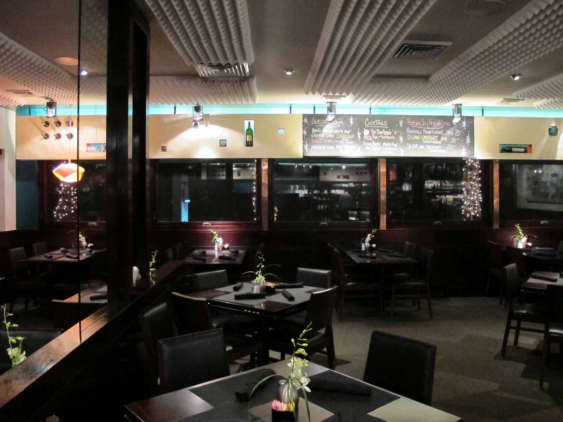 A restaurant with a lot of tables and chairs