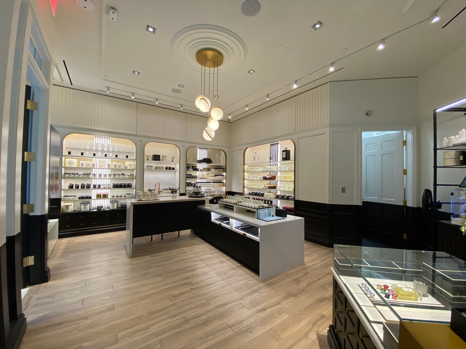 A large room with a lot of shelves and a ceiling light.