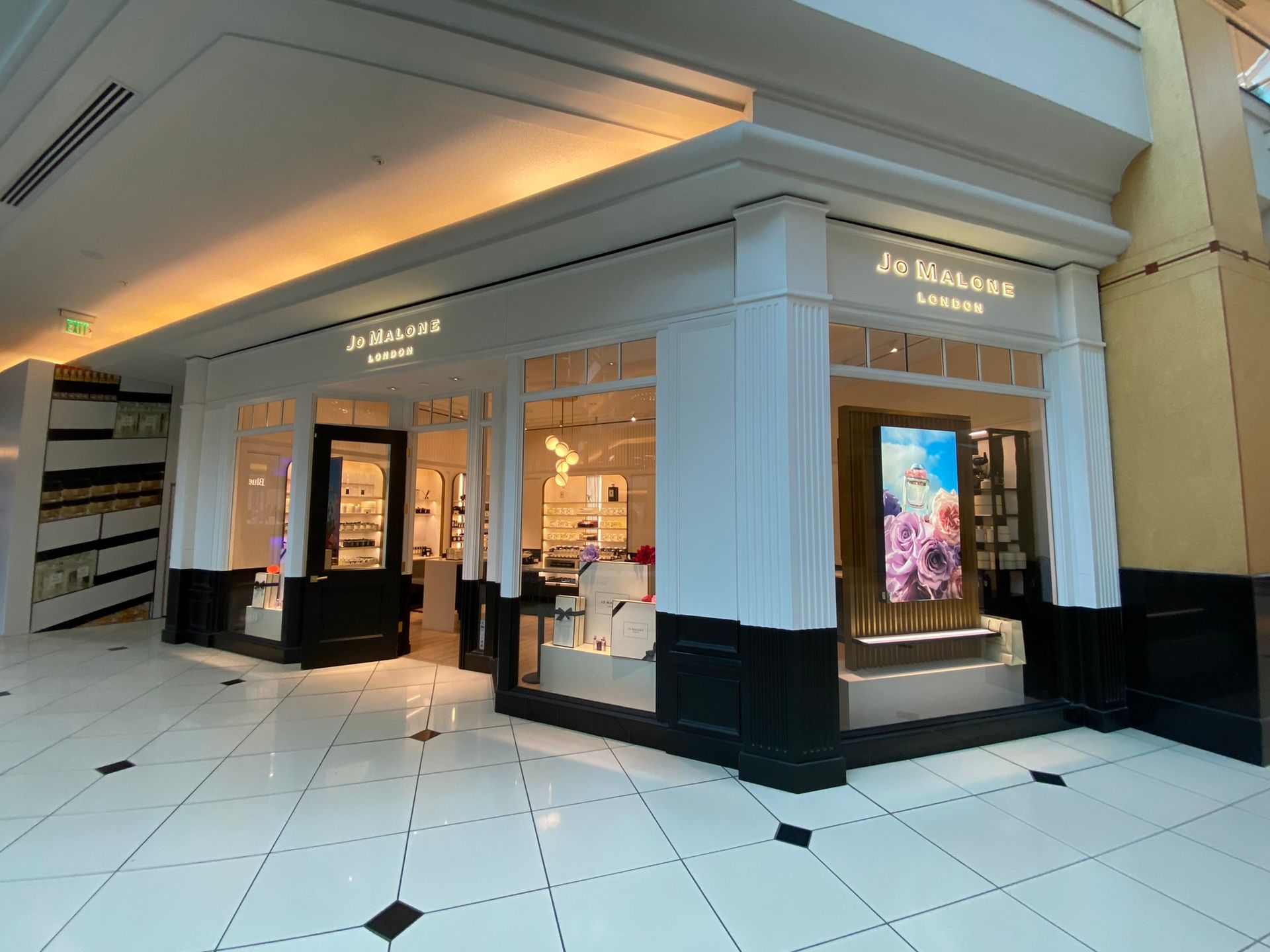 A large store in a mall with a lot of windows.