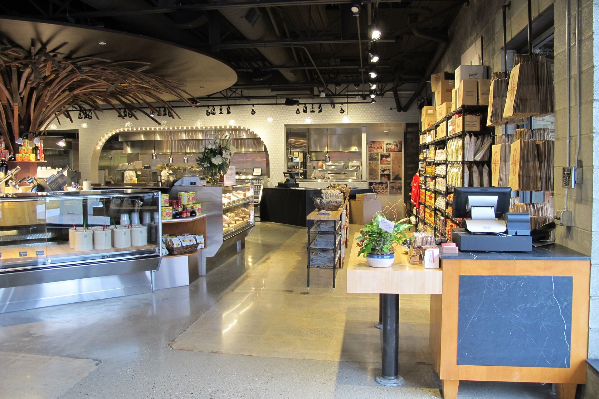 The inside of a store with a chalkboard and a cash register