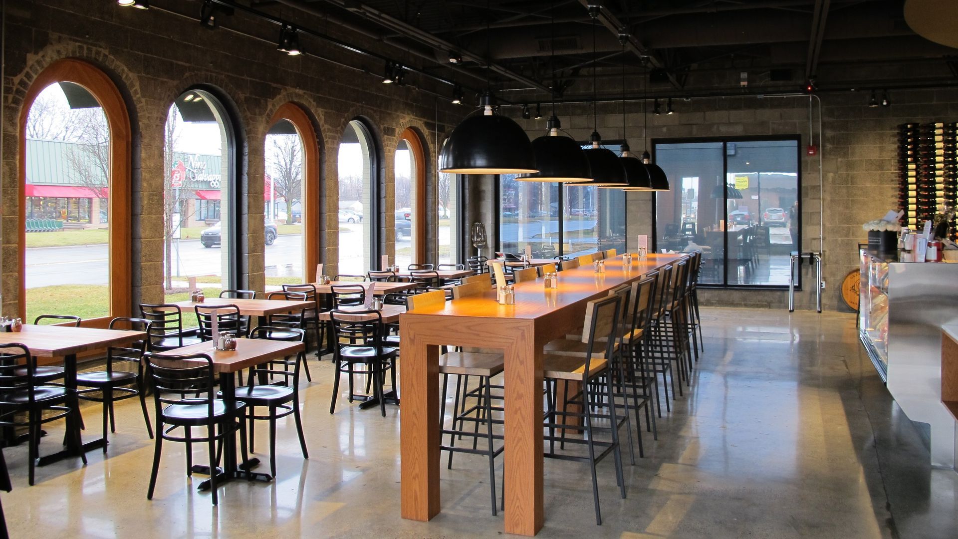 A restaurant with a lot of tables and chairs