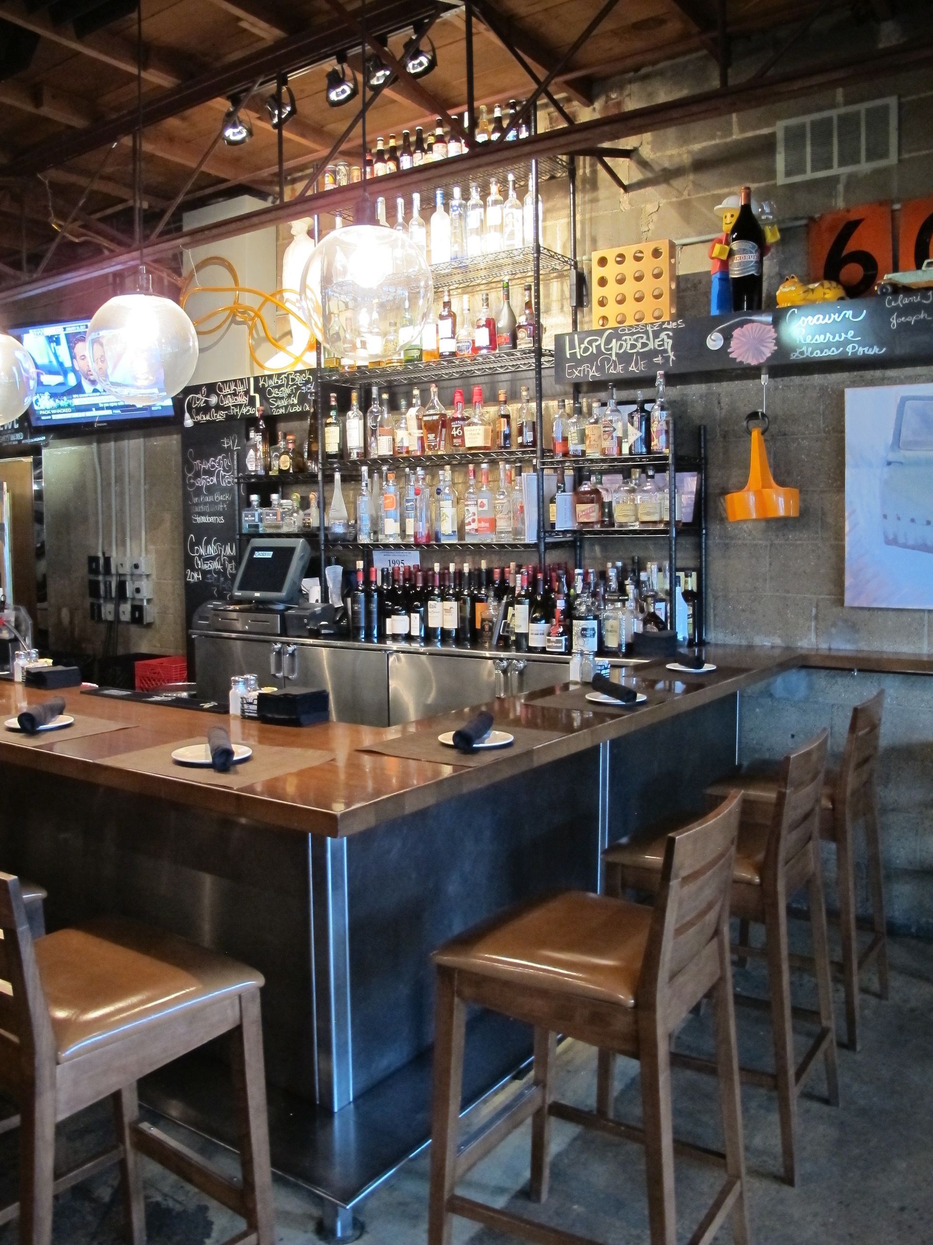 A bar in a restaurant with a number 6 on the wall