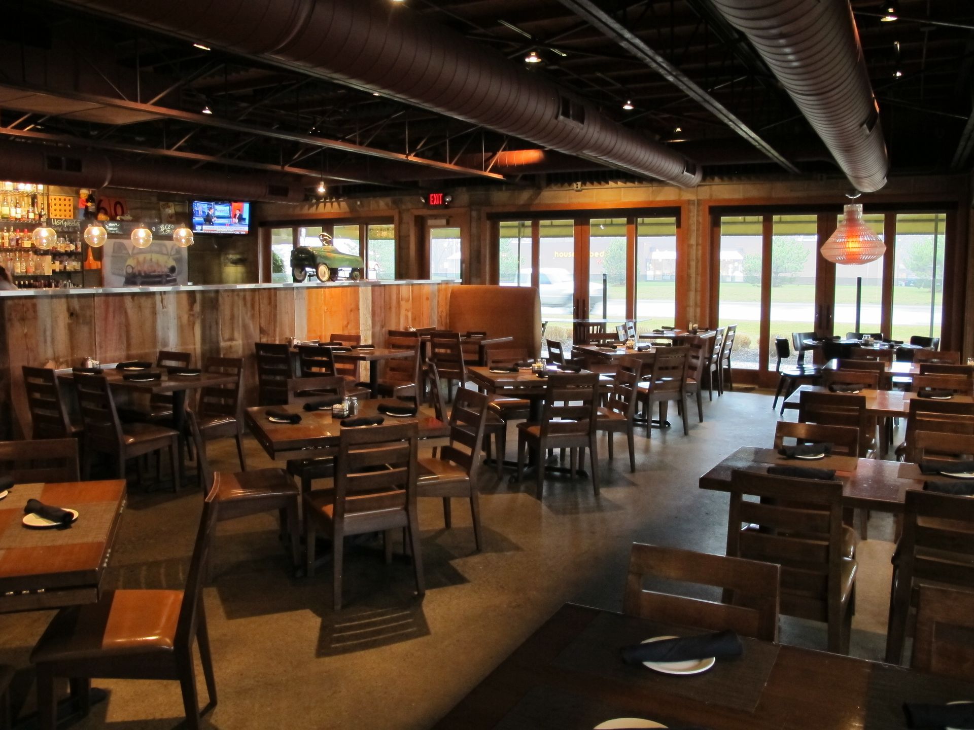 A restaurant with a lot of tables and chairs