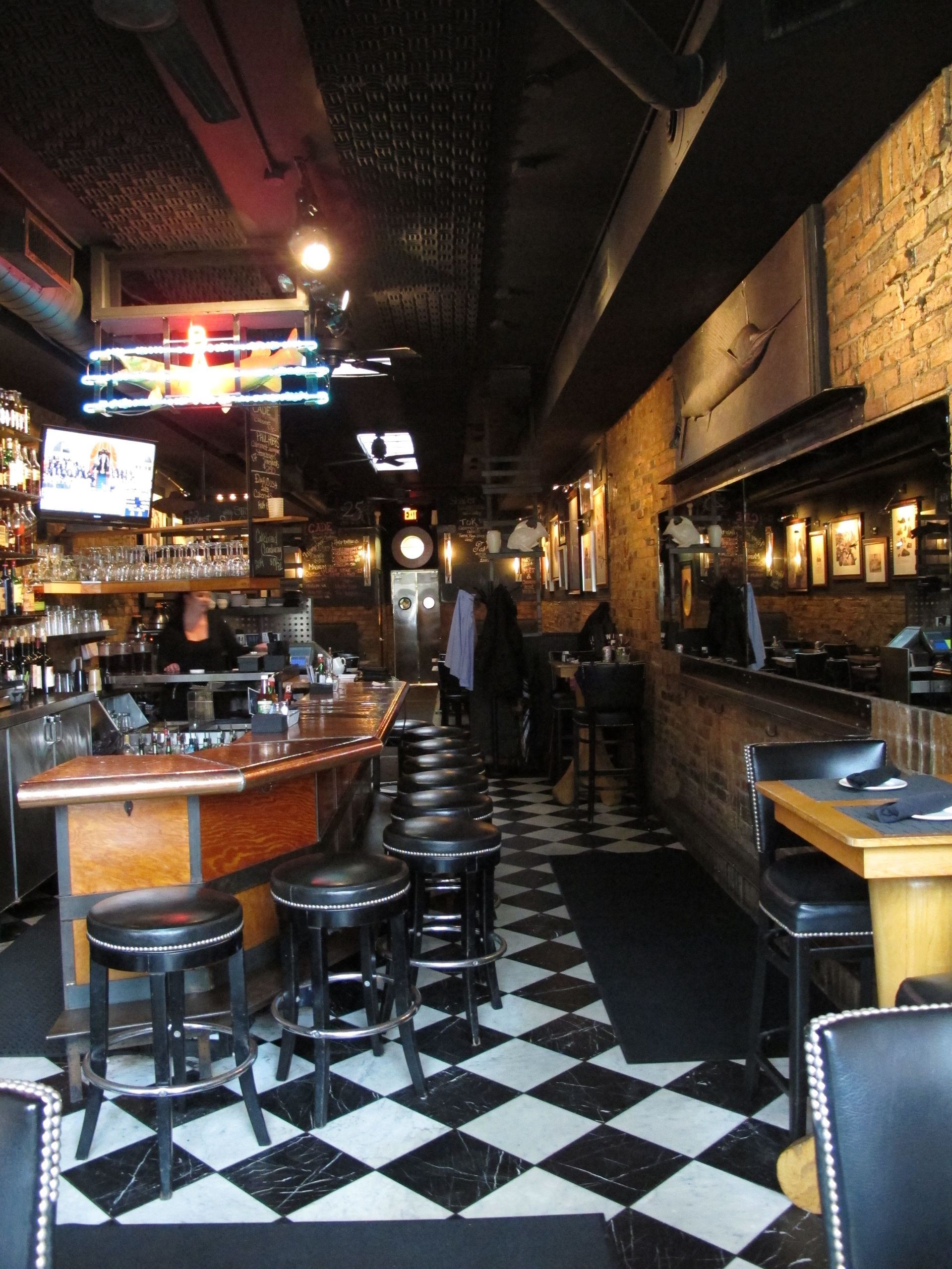 The inside of a restaurant with a checkered floor
