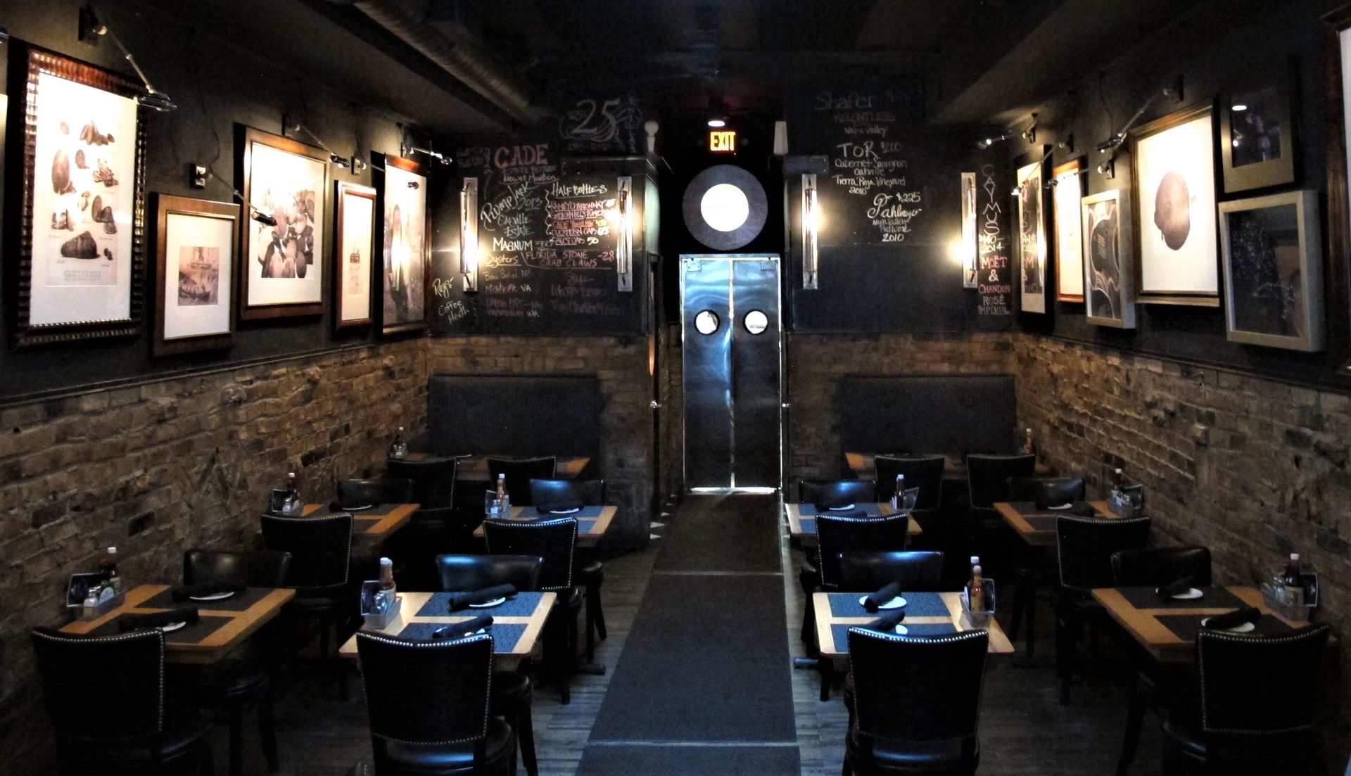 A restaurant with tables and chairs and pictures on the wall