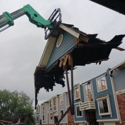 Two workers insulating an attic
