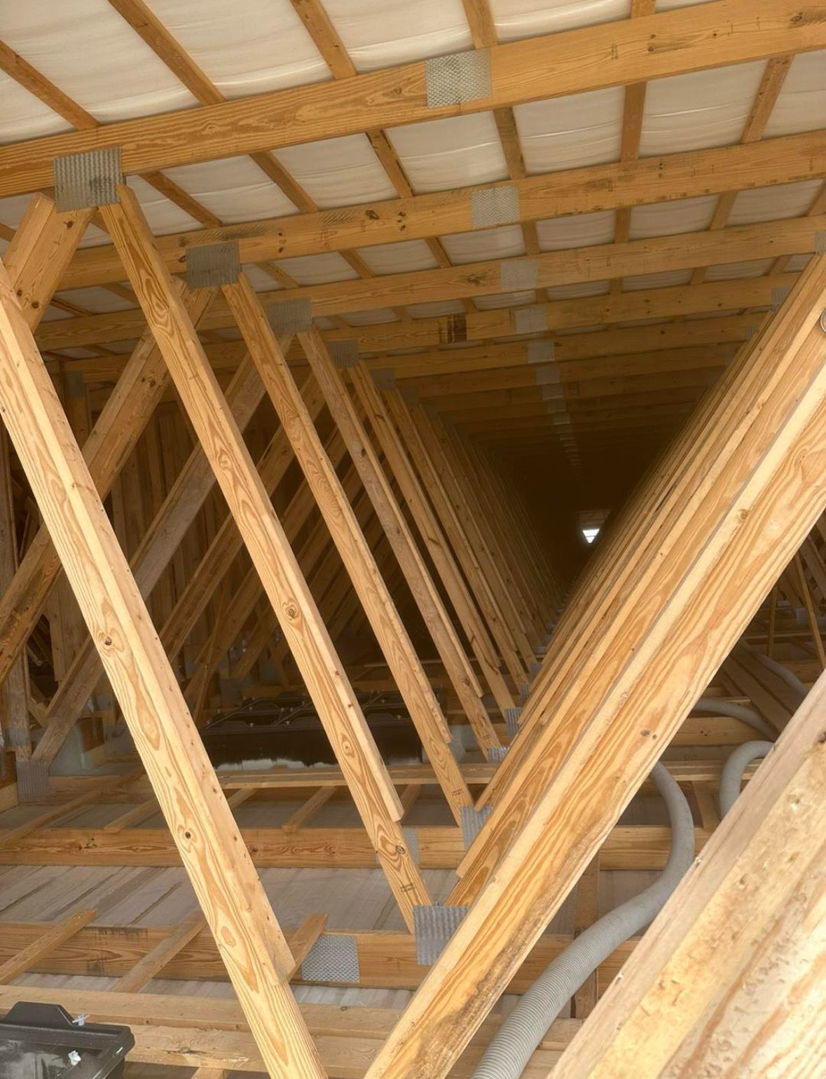 Wooden roof trusses in an attic