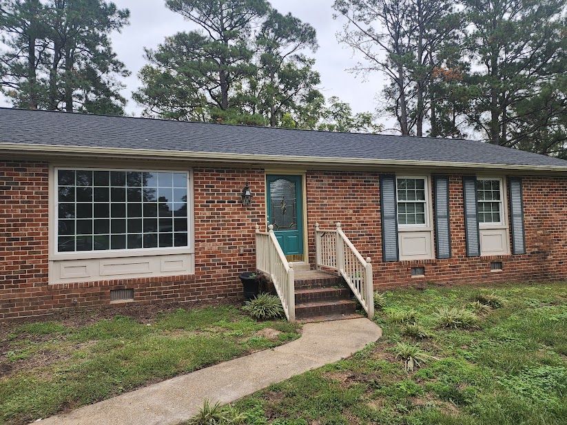 brick rancher with green door ideas