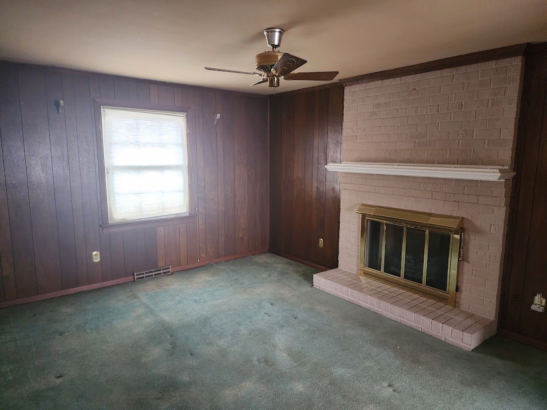 Brick fireplace that needs to be renovated home investment example before