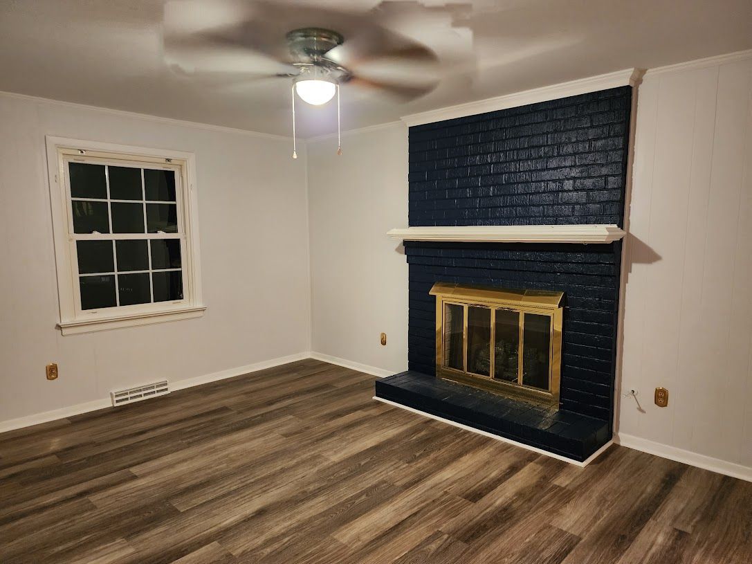 real estate renovation brick fireplace in navy blue sherwin williams naval