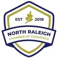 The north raleigh chamber of commerce logo is a shield with a leaf on it.