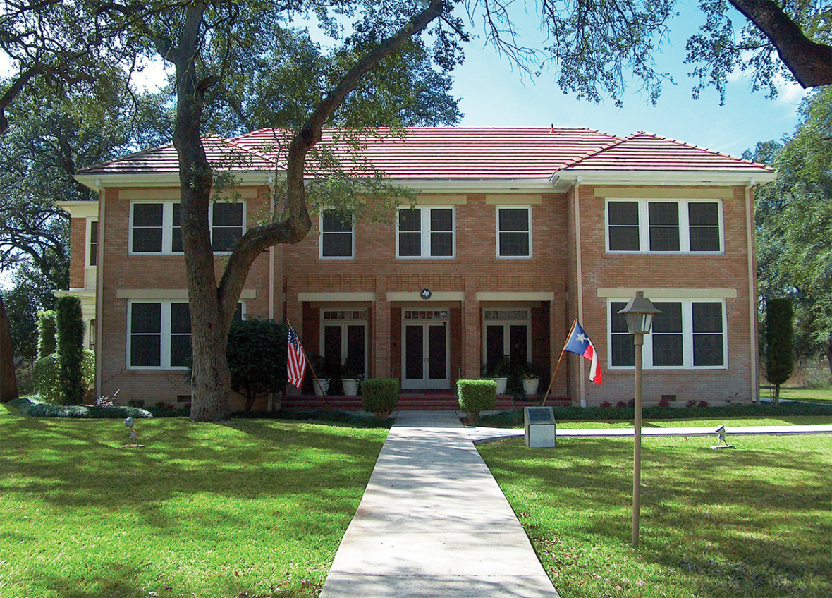 A large brick building with a red roof
