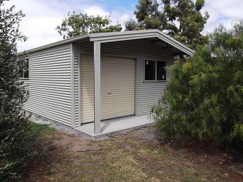 custom white shed with canopy