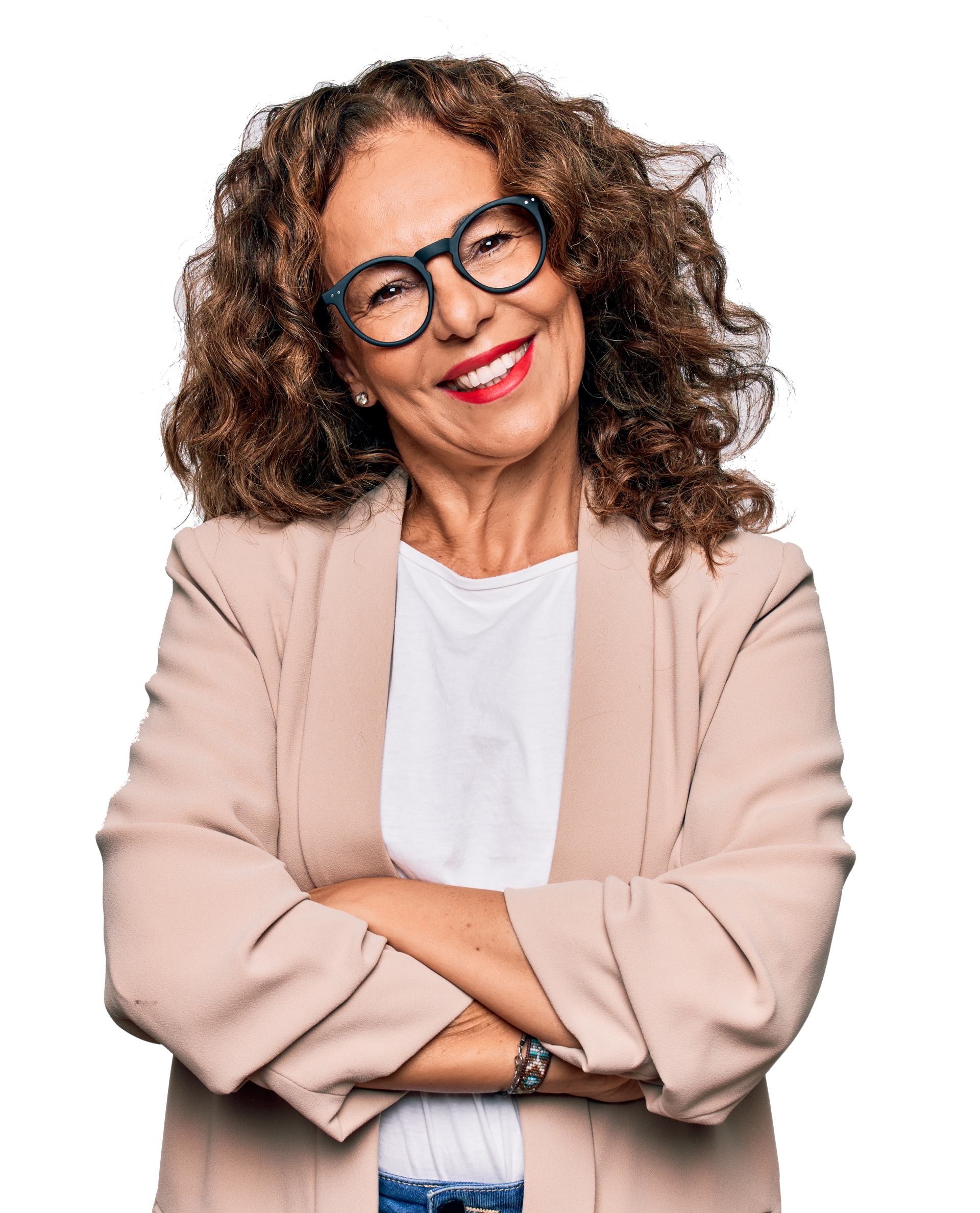 A woman wearing glasses and a jacket is smiling with her arms crossed.
