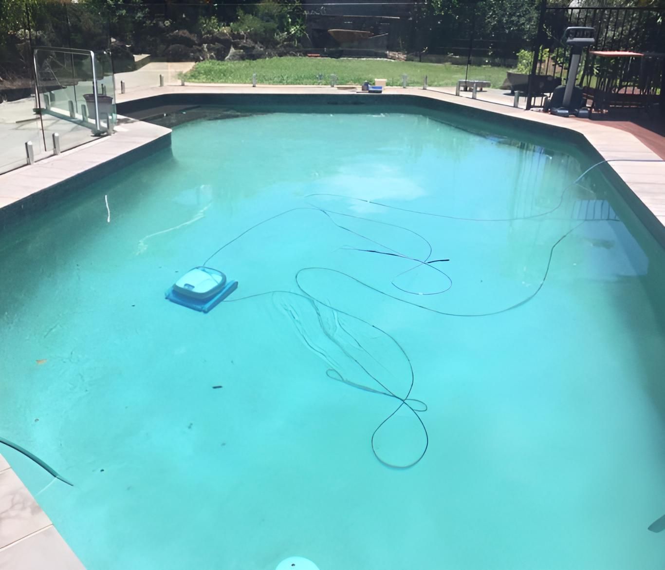 A Large Swimming Pool With A Robotic Cleaner In It — Aqua Duck Pool Care In Landsborough, QLD