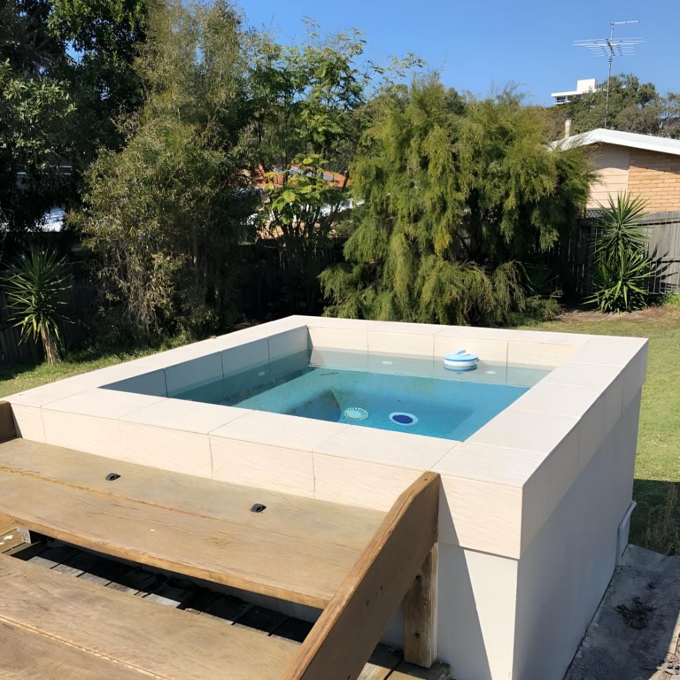 A Swimming Pool With Stairs Leading Up To It — Aqua Duck Pool Care In Landsborough, QLD
