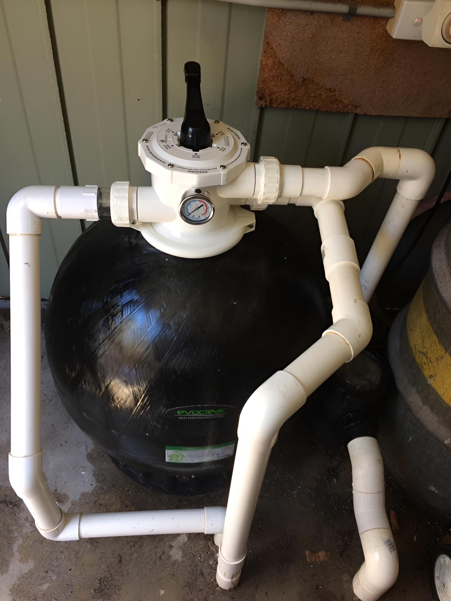A Heat Pump Is Sitting On Top Of A Wooden Floor — Aqua Duck Pool Care In Landsborough, QLD