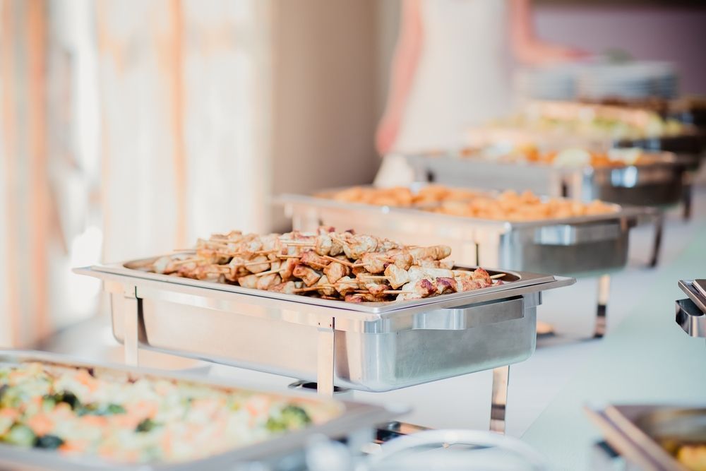 There Are Many Trays Of Food On The Table At A Buffet — Grafton Hire In South Grafton, NSW