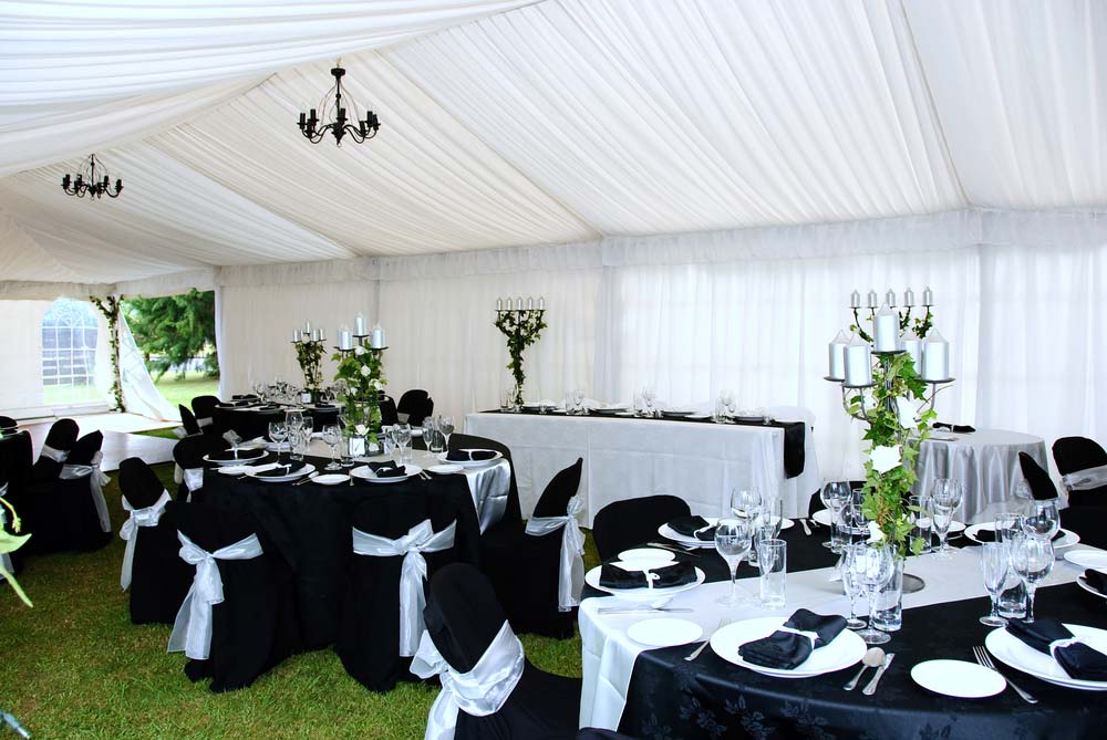 A Tent With Tables And Chairs Set Up For A Wedding Reception — Grafton Hire In South Grafton, NSW