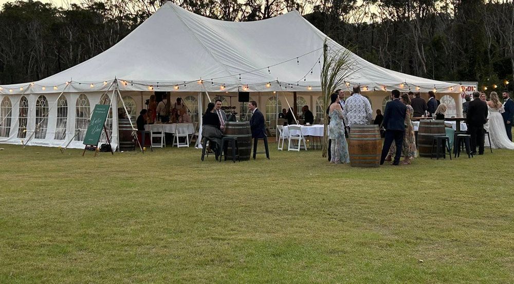 Group of People Celebrating a Marquee Wedding