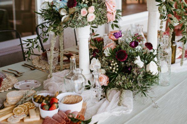 wedding tables with cozy decor in wedding marquee