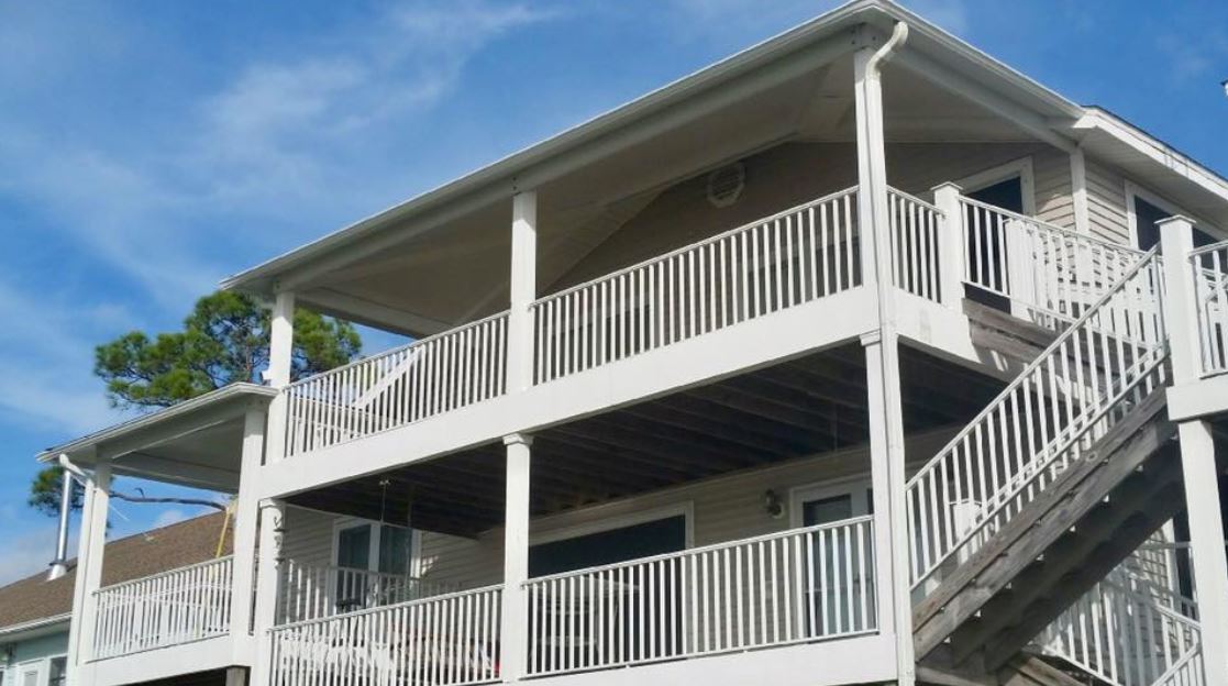 Commercial Patio Cover Installation — White Building with Patio Cover in Milton, FL