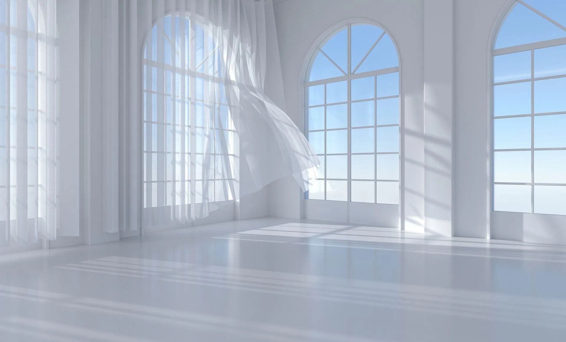 Una stanza luminosa e minimalista con finestre ad arco, pareti bianche e una tenda trasparente che ondeggia nella brezza.