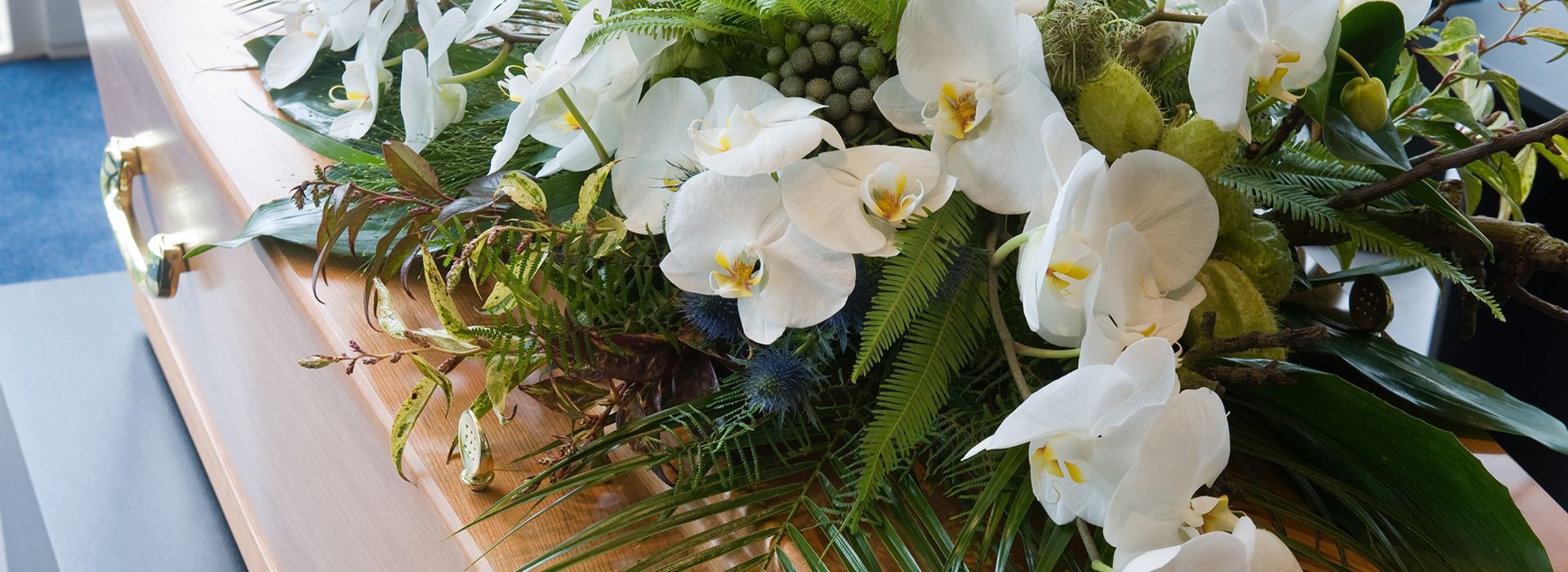 White lilies on coffin