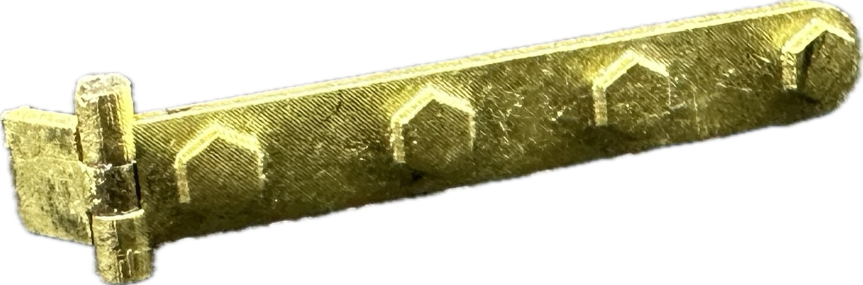 A close up of a gold object on a white background.