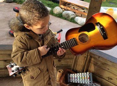 A child playing a guitar